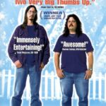 poster for "American Movie" - two white men with long brown hair (Mark Borchardt and Mike Schank) stand facing the camera. Review from Siskel and Ebert says "Terrific! Funny! Inspiring! Two Very Big Thumbs Up!" Text reads: Winner Grand Jury Prize Sundance Film Festival