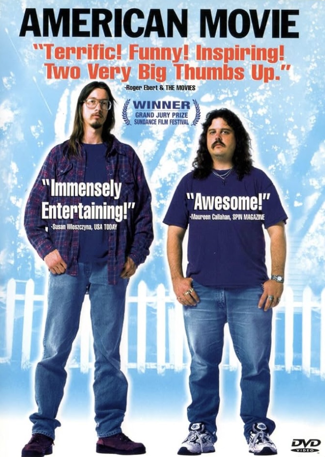 poster for "American Movie" - two white men with long brown hair (Mark Borchardt and Mike Schank) stand facing the camera. Review from Siskel and Ebert says "Terrific! Funny! Inspiring! Two Very Big Thumbs Up!" Text reads: Winner Grand Jury Prize Sundance Film Festival