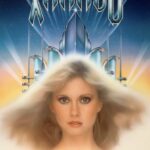 Poster for movie "Xanadu" - Olivia Newton-John's face with blond hair blown back in front of a futuristic-looking set of silver columns.